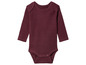 Un body bébé à manches longues de couleur bordeaux.