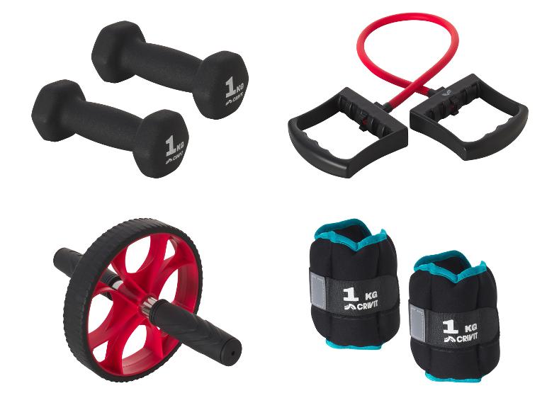 Haltères, un rouleau abdominal, des poids de cheville et un élastique de résistance pour le fitness.