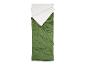 Sac de couchage vert avec intérieur blanc, partiellement ouvert et posé à plat.