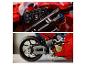 Gros plan d'une moto Lego Technic Ducati rouge, montrant le tableau de bord et la roue arrière.