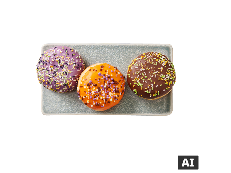 Trois beignets Berliner avec des vermicelles colorés sur une assiette. [image générée par l'IA]
