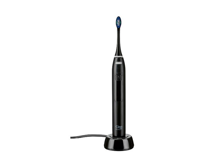 Brosse à dents électrique noire Cien Beauty sur une base de chargement.
