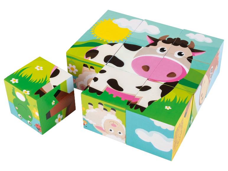 Puzzle en bois avec des images d'une vache, d'un mouton, d'une grenouille et d'un cerf.
