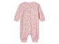 Combinaison bébé rose à motifs animaux.