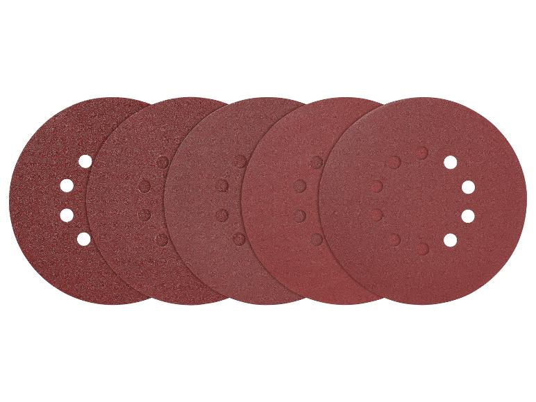 Cinq disques de papier abrasif pour une ponceuse.
