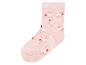 Une chaussette rose avec des ballerines imprimées.