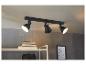 Un spot de plafond noir avec trois lampes.