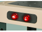 Boutons rouges lumineux avec icônes de scie circulaire et de perceuse, pour outils électriques.