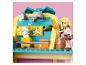 Ensemble Lego Friends avec une figurine brossant un lapin blanc dans un salon pour animaux.