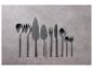 Couverts noirs mats : spatules, cuillères, fourchettes.
