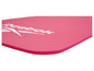 Un tapis de fitness rose Reebok avec une surface striée.