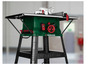 Une scie circulaire de table verte Parkside sur un support noir.