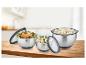 Trois bols en acier inoxydable GSW avec couvercles sur une table en bois.