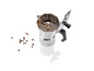 Une cafetière italienne avec des grains de café à côté.