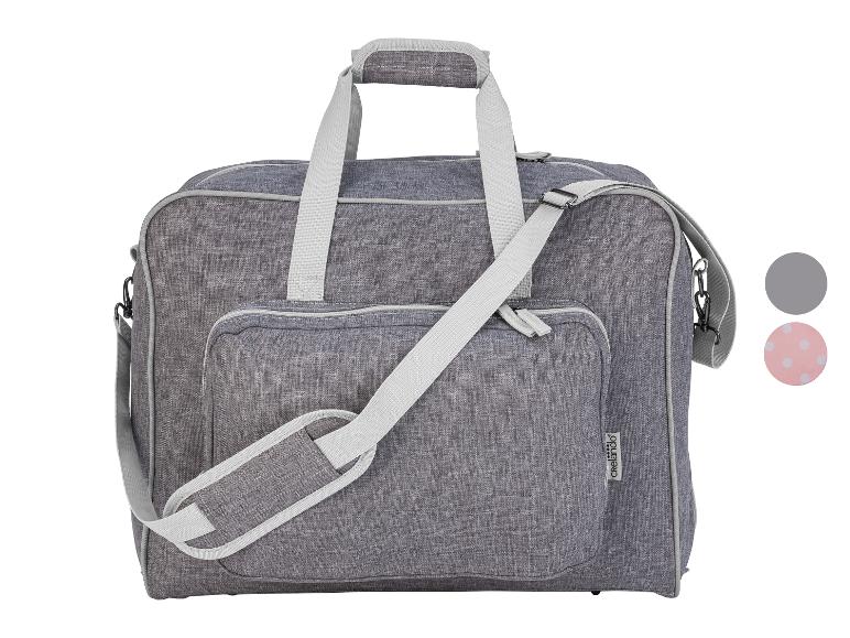 Sac de couture gris avec poignées et bandoulière, avec deux échantillons de couleur.