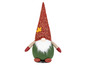 Un gnome en peluche avec un bonnet rouge et une tenue verte.