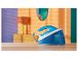 Un fer à repasser Philips PerfectCare Compact bleu sur une table en bois.