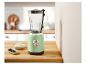 Un mixeur SilverCrest vert clair sur un comptoir en bois.