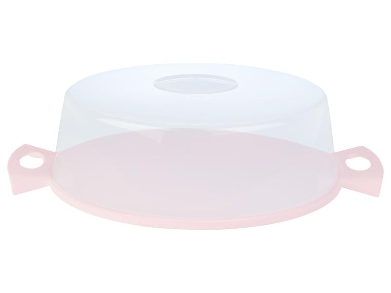 Un plateau à gâteau rose avec un couvercle transparent.