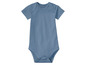 Un body bébé bleu à manches courtes.
