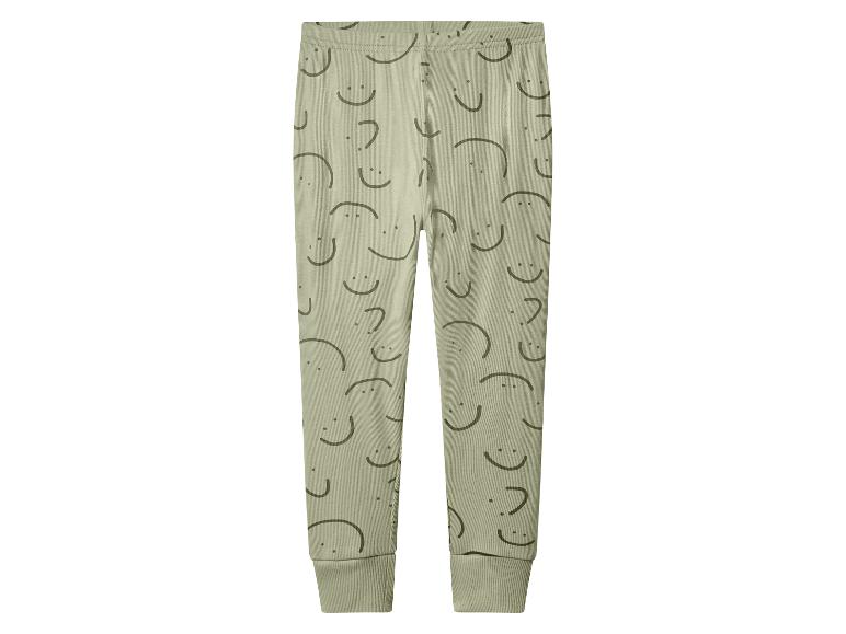 Legging côtelé vert avec motif de visages souriants