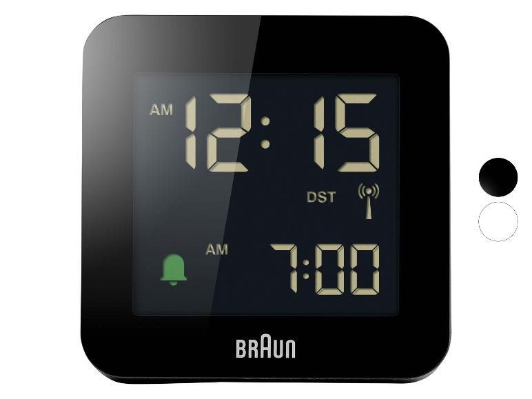 Réveil numérique noir avec affichage montrant 12:15 AM et alarme réglée à 7:00 AM.