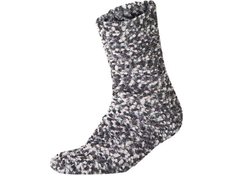 Chaussette épaisse tricotée avec un motif sel et poivre dans les tons gris et blanc.