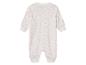 Combinaison bébé rose pâle à motifs nuages.