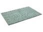 Tapis de bain vert clair, texture moelleuse.