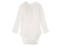 Un body blanc à manches longues pour bébé de la marque Miliu.