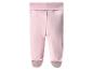 Leggings roses pour bébé avec pieds.