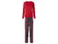 Haut rouge à manches longues et pantalon de pyjama à carreaux rouges et verts.