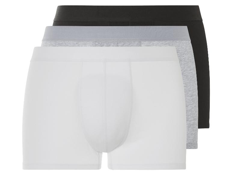 Trois boxers en blanc, gris et noir.