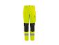 Pantalon de travail haute visibilité jaune fluo avec genouillères noires et bandes réfléchissantes.
