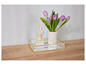 Un plateau en verre avec un bord doré, un diffuseur et un vase avec des tulipes.