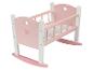 Berceau en bois rose pour poupées avec base à bascule.
