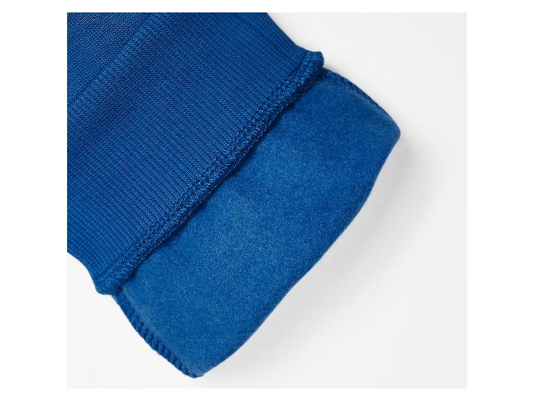 Manchette en tissu côtelé bleu avec doublure polaire.