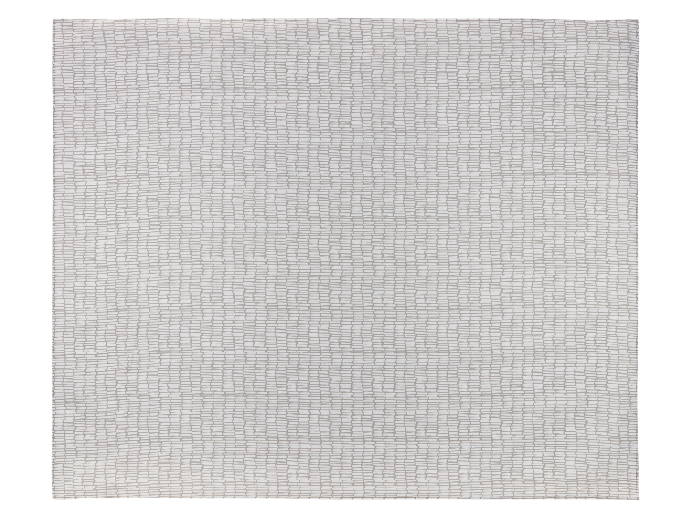 Serviette en tissu avec un motif de blocs gris sur fond blanc.