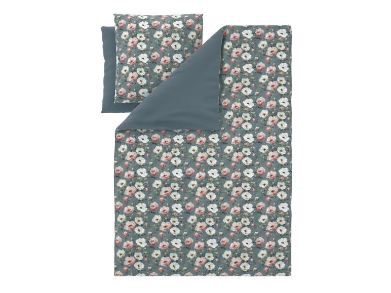 Parure de lit housse de couette et taie d'oreiller à motif floral rose et blanc.