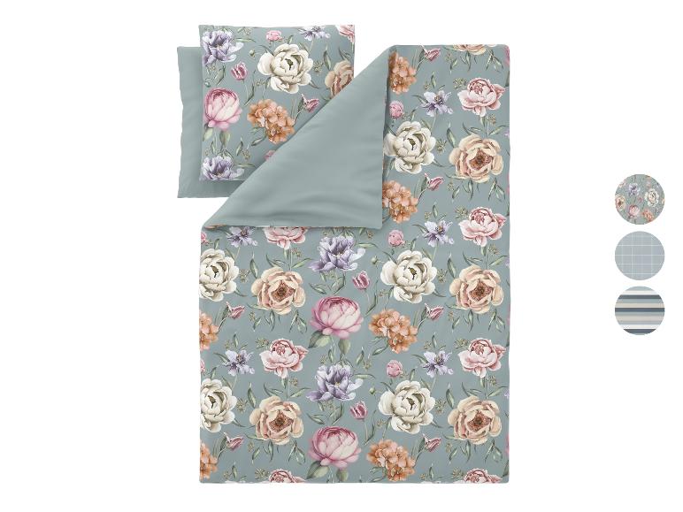 Parure de lit à motif floral avec envers uni, comprenant oreiller et housse de couette.