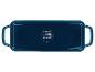 Plat de cuisson rectangulaire bleu avec poignées, avec icônes d'utilisation pour divers types de cuisson.