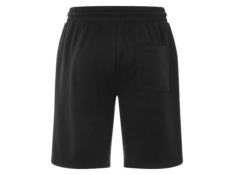 Short de survêtement noir avec élastique et cordon de serrage.