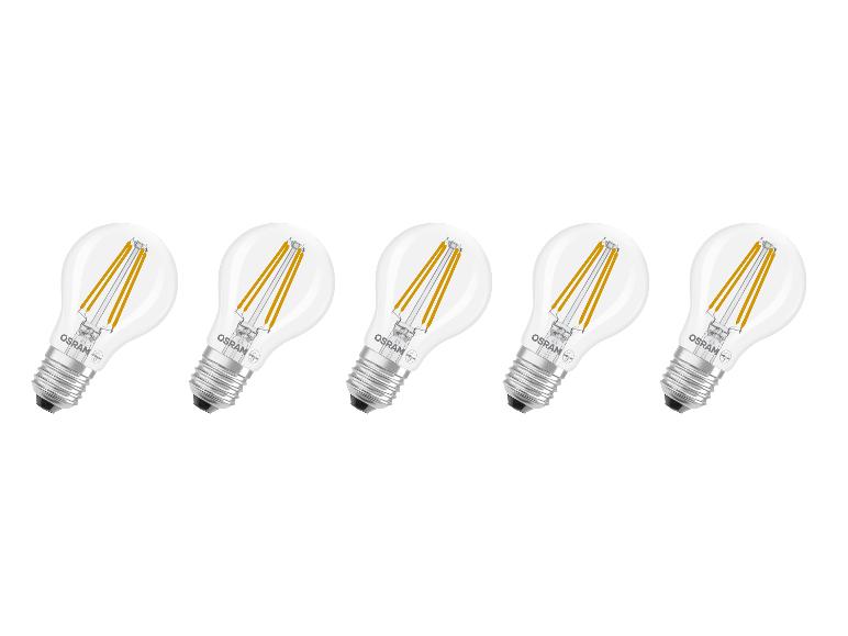 Cinq ampoules LED à filament transparent avec culot à vis, disposées en diagonale.