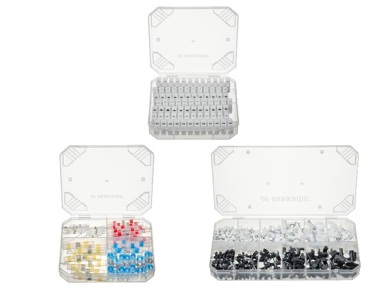 Trois boîtes de rangement avec connecteurs de câble, cosses thermorétractables et serre-câbles.