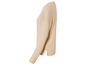 Pull en maille beige à manches longues.
