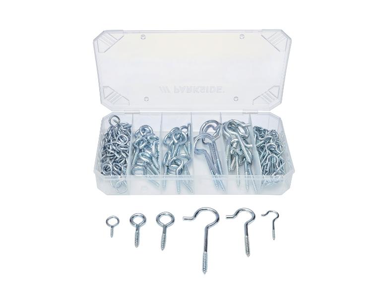 Boîte transparente avec vis et crochets métalliques de différents types et tailles.