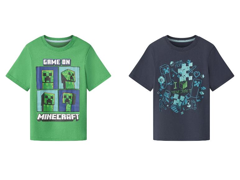 Deux t-shirts enfants Minecraft : un vert avec 'GAME ON' et un bleu foncé avec 'I LOVE MINECRAFT'.