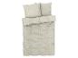 Draps beiges avec des feuilles blanches.