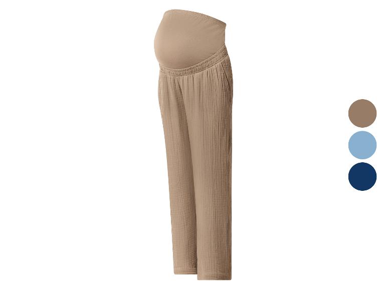 Pantalon de maternité beige avec large ceinture élastique, disponible en trois couleurs.
