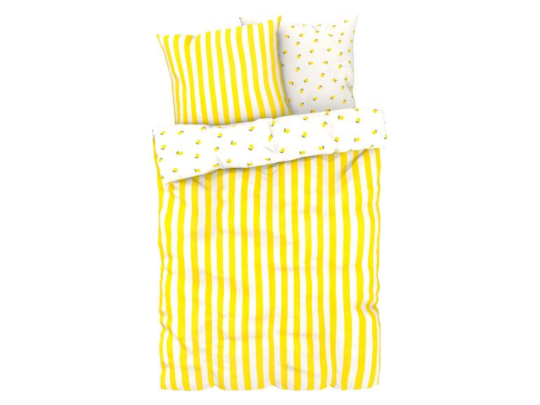 Parure de lit rayée jaune et oreillers à motifs citrons.